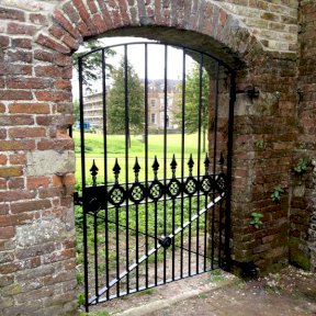 Forged Gate Fitted into an Archway in a Wall